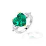 Ring, 18-carat white gold with diamonds and emeralds